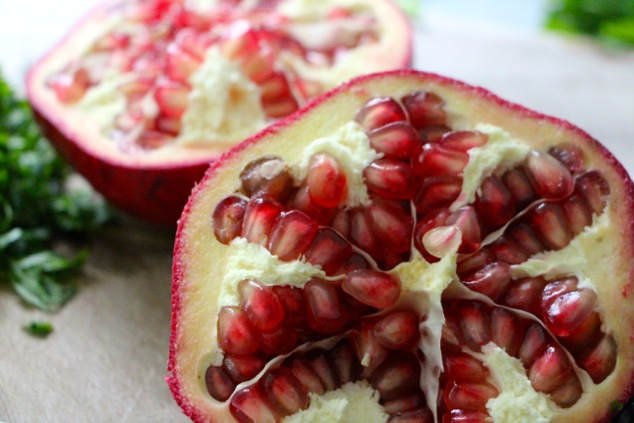 pomegranate on cutting board