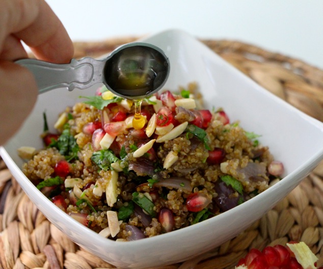 drizzling honey on quinoa salad