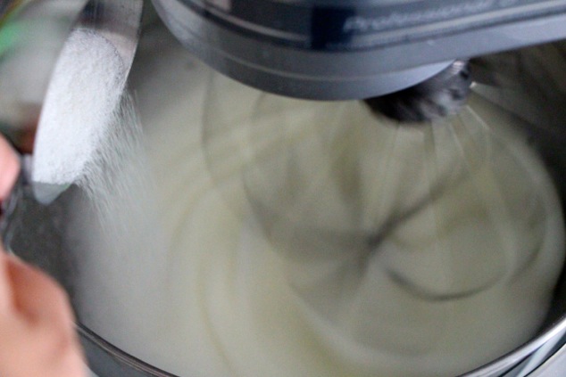 adding-sugar-to-egg-whites-in-mixer