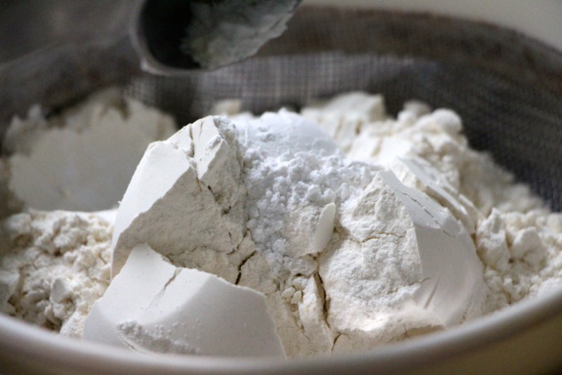 flour-and-baking-powder-in-sifter-up-close