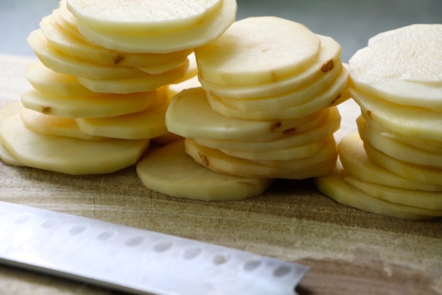 potato-slices-on-cutting-board