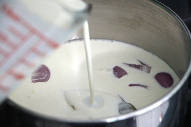 pouring-heavy-cream-into-saucepan