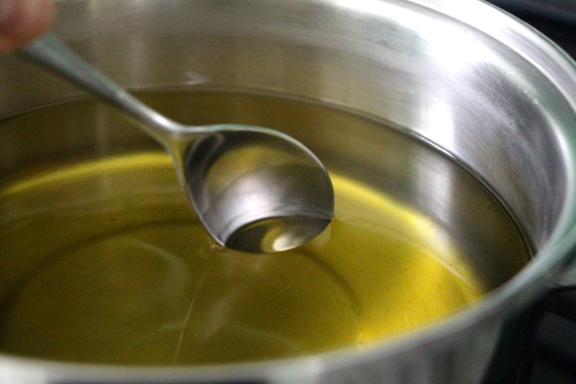 dipping-a-spoon-into-oil