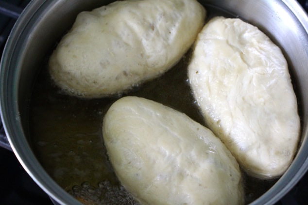 frying fricassee dough rolls in oil