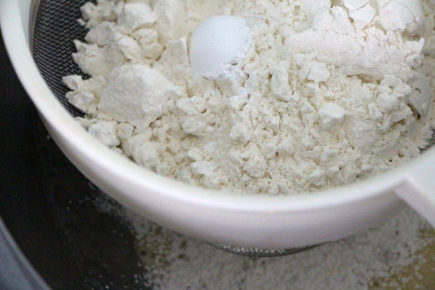 sifting-flour-and-baking-powder-into-mixture
