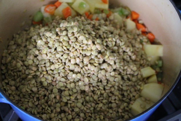 adding lentils to the pot