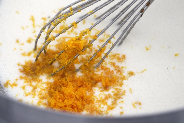 adding orange zest to mixture