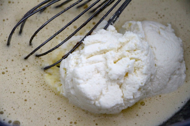 adding ricotta cheese to mixture