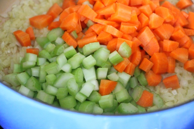 chopped carrots and celery in a pot