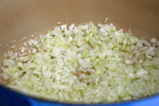 sautéing onions in a pot