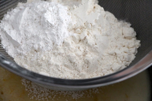 sifting flour into mixture
