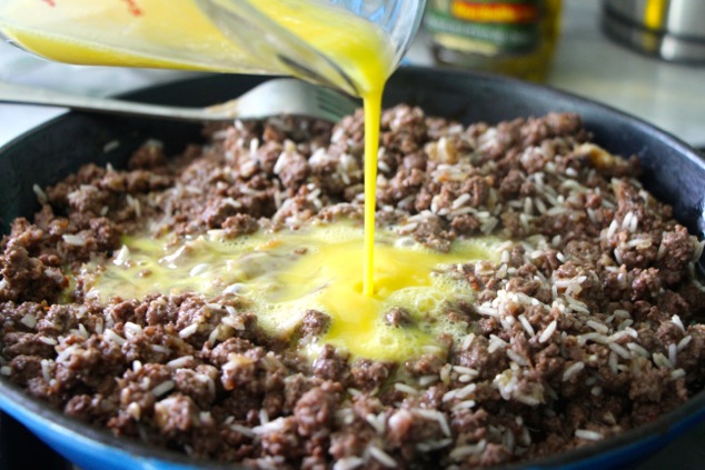 adding egg to the meat mixture
