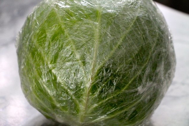 cabbage wrapped in plastic wrap