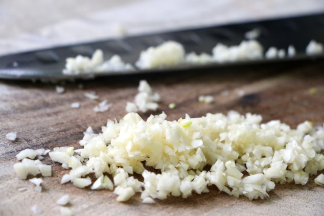 chopping garlic up close