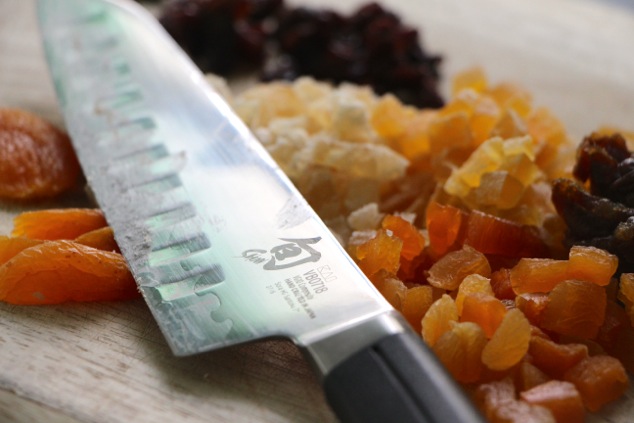 cutting dried fruit into cubes