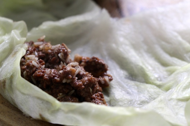 folding the cabbage leaf over the filling