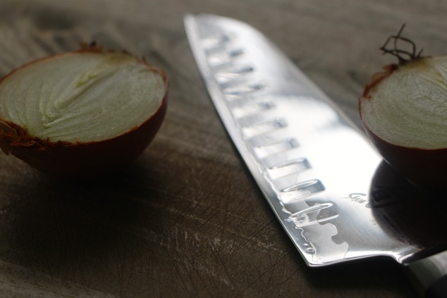 halved onion and a knife