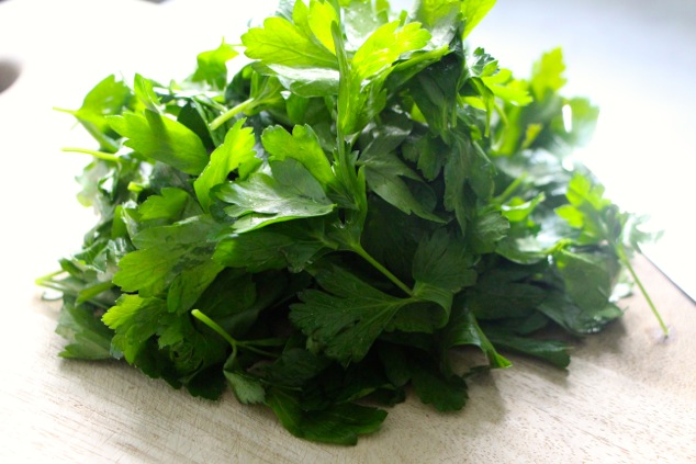 parsley leaves pile on a cutting board