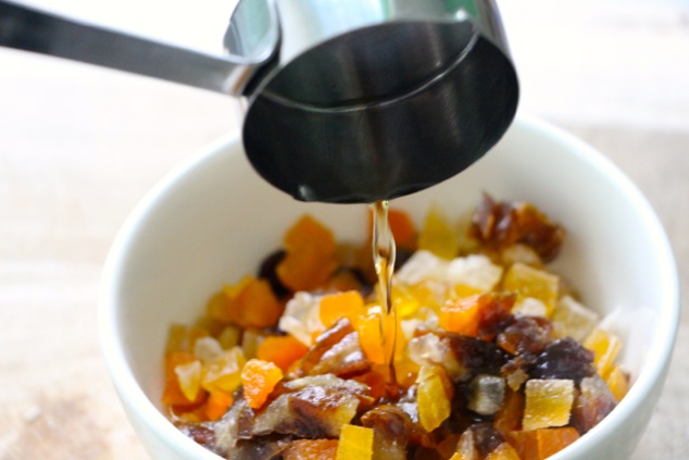 pouring brandy onto dried fruits