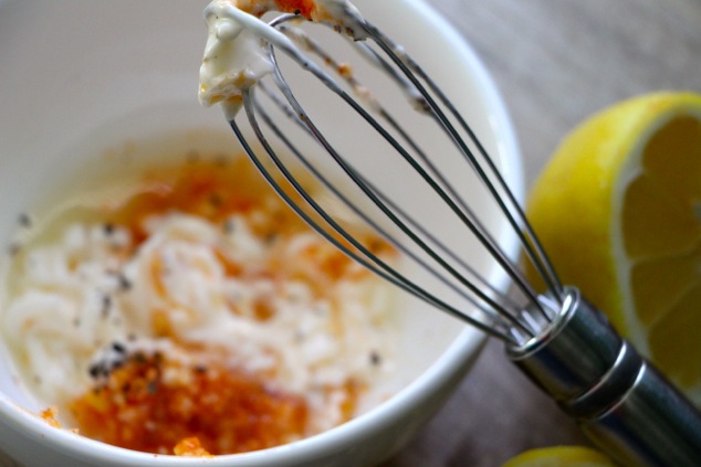 whisking aioli ingredients