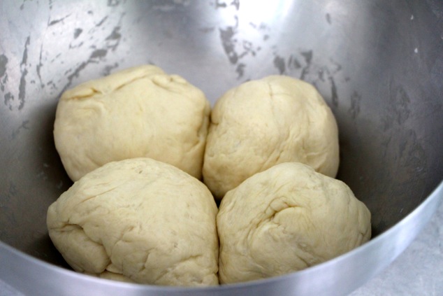 dividing the dough into four portions