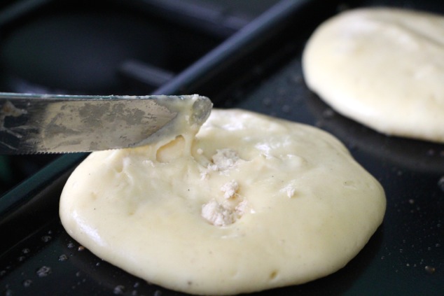 pushing Halva crumbs into pancakes
