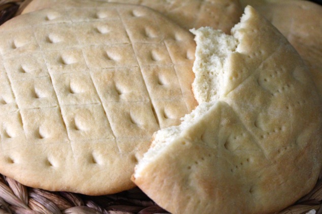 serving Zradak Purim flat bread