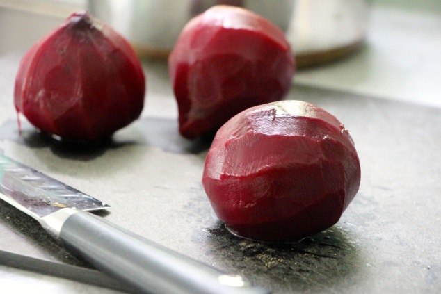 boiled beets onto cutting board