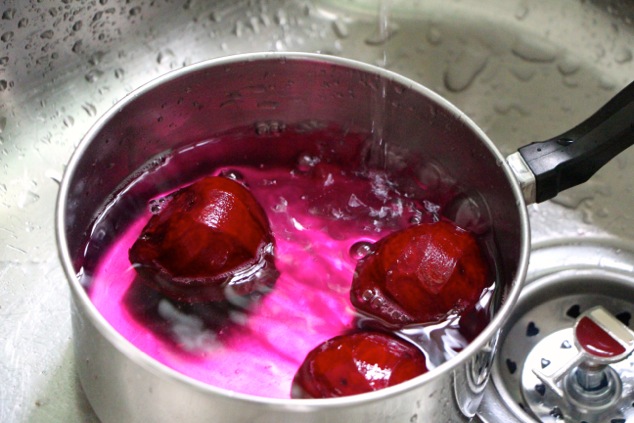 filling water in pot with beets