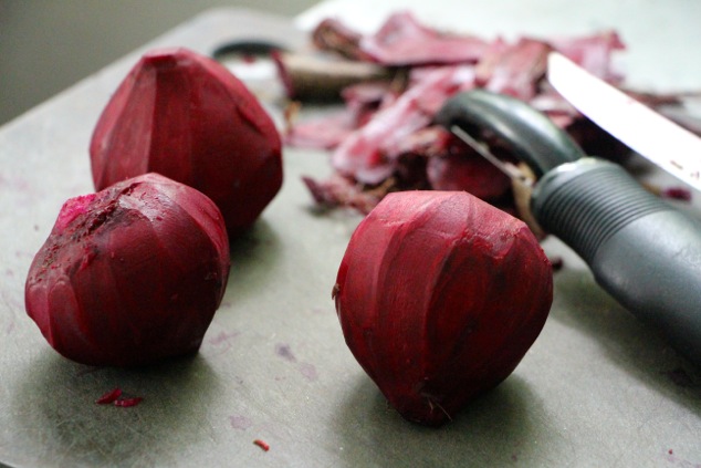 peeled beets on a cutting board