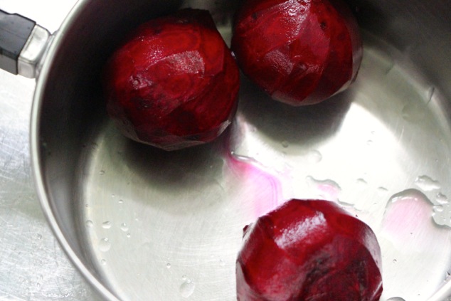 three beet bulbs in a pot