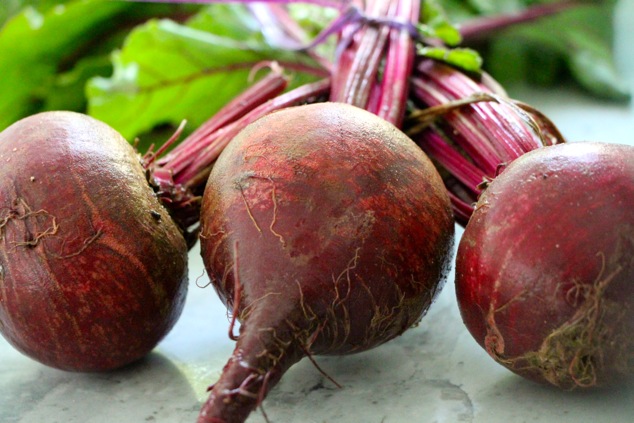 three fresh beets up close