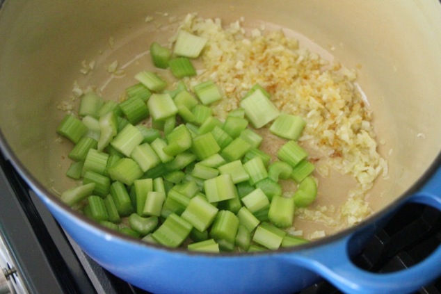 adding celery pieces to pot