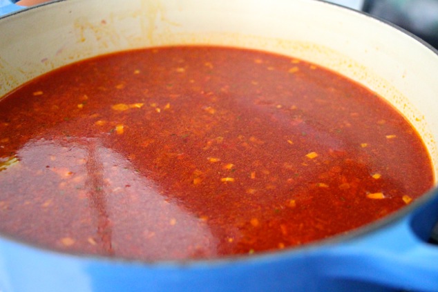 adding water to the soup