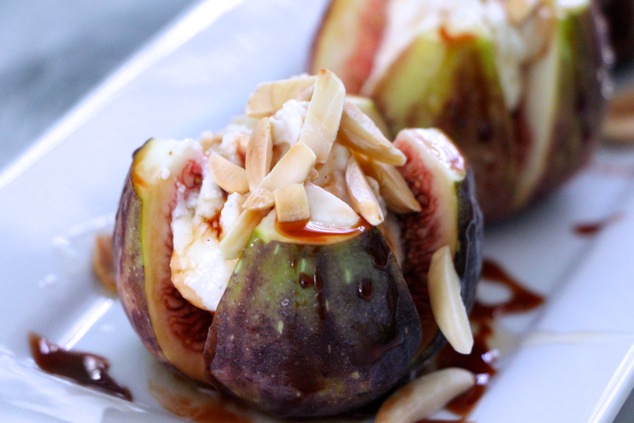 fresh figs with cheese almonds honey and silan up close