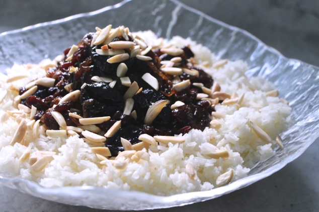 white rice and dried fruit in serving bowl