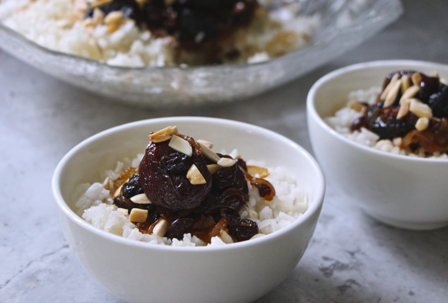 white rice and dried fruit in serving dishes