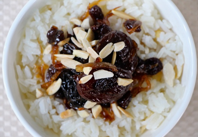 white rice and dried fruit served up close from above