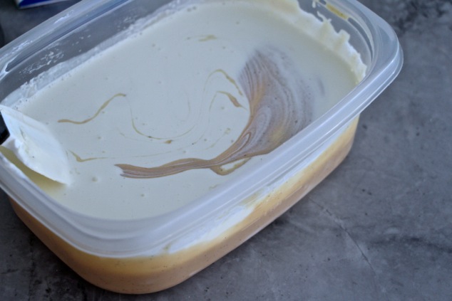 adding heavy cream to honey vanilla ice cream base