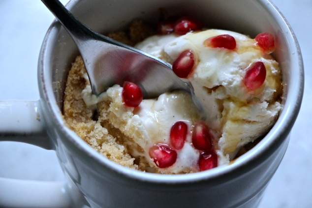apple pomegranate crumble served with a spoon