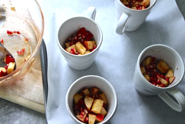 layering fruit mixture in mugs