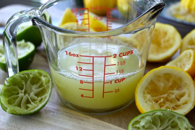 lemon and lime juice in measuring cup