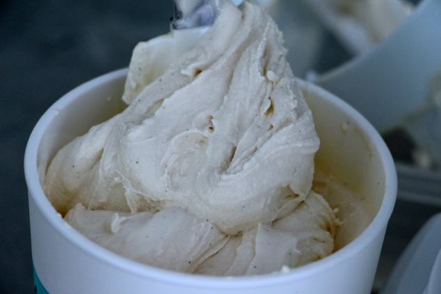 transferring honey vanilla ice cream to container