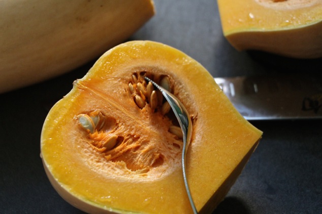 cleaning butternut squash up close