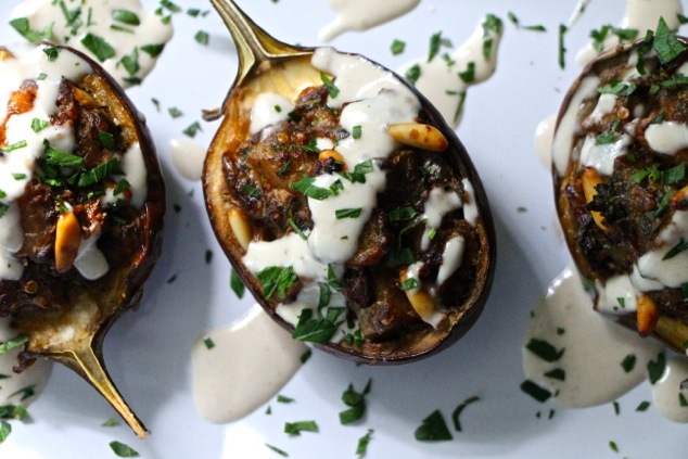 stuffed eggplants topped with Tehina and fresh parsley