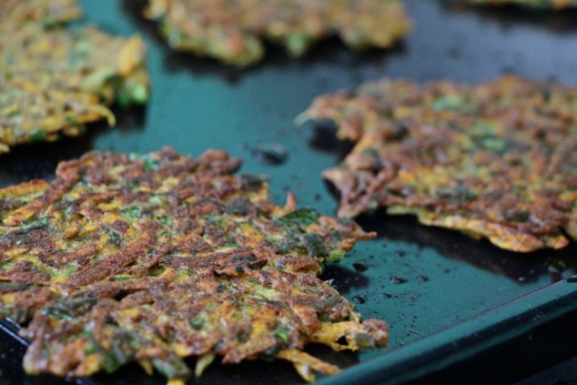 frying latkes on the other side up close