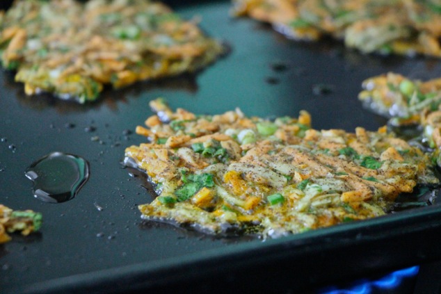 frying sweet potato kohlrabi latkes up close