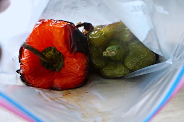 putting roasted peppers into a sealed bag
