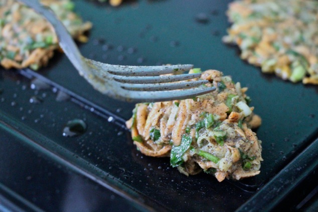 scooping latke mixture onto griddle