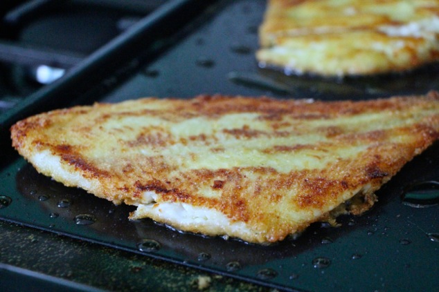 frying fish filets up close